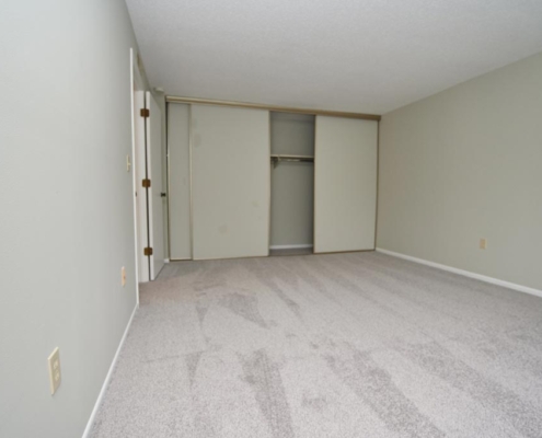 Bedroom Detail with accommodating closets at St. Clair Woods Apartments